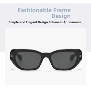 Close-up of black geometric sunglasses frame with gold rivet details on white background