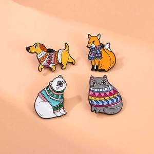 Set of four cute animal enamel pins featuring a dachshund fox polar bear and cat in sweaters