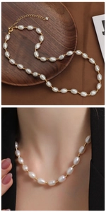 Detail of natural freshwater pearl necklace with golden beads and adjustable clasp