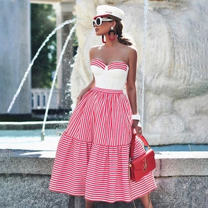 Women's chic red and white striped tube top and matching tiered skirt outfit with sailor hat