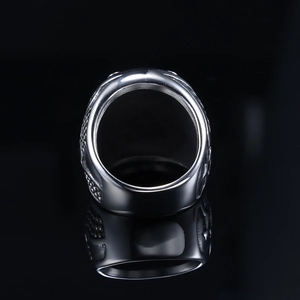 Polished silver lion head ring for men with vintage finish on black background