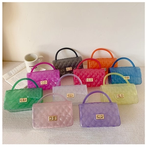 Close-up of quilted jelly bags with beaded handles in vibrant assorted colors