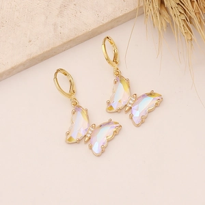 Detail of 18K gold butterfly hoop earrings with iridescent aurora crystal and zircon stones