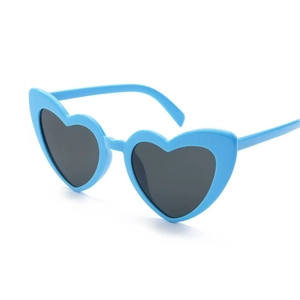 Detailed view of heart-shaped sunglasses with bright blue frames and dark lenses