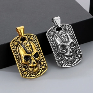 Detailed relief of gothic skull pendants in gold and silver on dog tag style plates