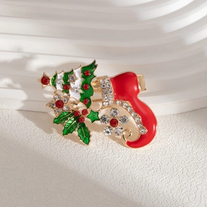 Detail of Christmas stocking brooch with colorful enamel work and sparkling rhinestones