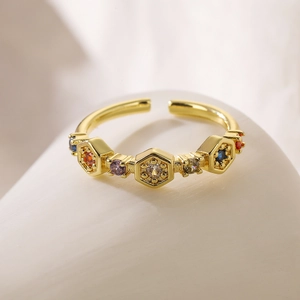Macro shot of 18K gold plated honeycomb ring with colorful zircon stones and open design