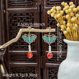 Detail of butterfly pearl earrings with dimensions and weight specs in vintage setting