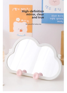 Detailed view of cloud-shaped desktop makeup mirror with white frame and cute pink legs