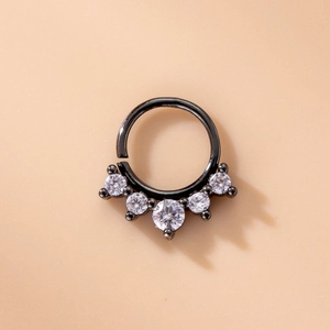 Close-up of black metal nose ring featuring five micro-pave round cubic zirconia stones