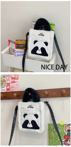 Detail of white plush panda crossbody bag featuring Angry Panda embroidery and leather strap