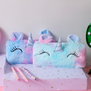 Detail of plush unicorn pencil case featuring tie-dye faux fur and 3D glitter horn