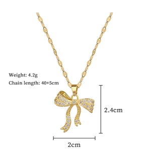 Detailed dimensions of bow pendant necklace with sparkling cubic zirconia on flat link chain