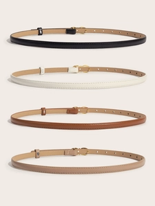 Detail of four thin women's belts in black, white, brown and beige with gold buckles