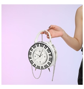 Detail of creative round bag featuring clock face design and piano key patterns