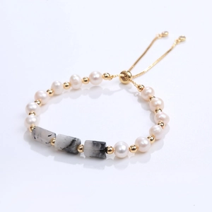 Elegant pearl and rectangular semi-precious stone bracelet with adjustable gold slider clasp
