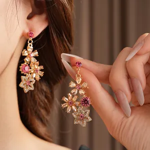 Vintage floral drop earrings with pink and clear crystals in gold-toned settings
