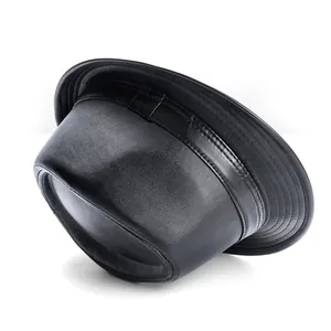 Detail of black PU leather hat showing circular stitching on the brim and fine matte texture