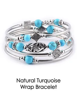 Detail of bohemian multilayer wrap bracelet with turquoise beads and embossed metal spacers