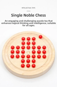 Top view of a wooden peg solitaire board game with vibrant red playing pieces