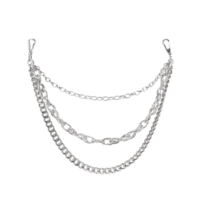 Detailed view of silver triple-layered metal pants chain with heavy Cuban and curb links