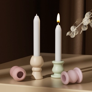 Pastel geometric resin candle holders with matte finish and long white candles