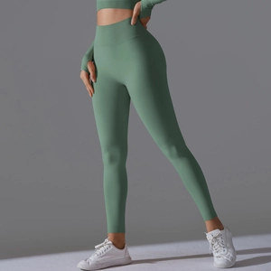 Close-up of high-waist yoga set showing seamless knitted texture and thumbhole detail