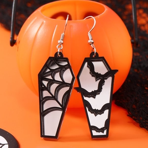 Macro detail of Halloween acrylic earrings featuring spider web and bat silhouette designs