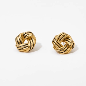 Elegant gold twisted knot earrings with black stripe accents on a clean white background