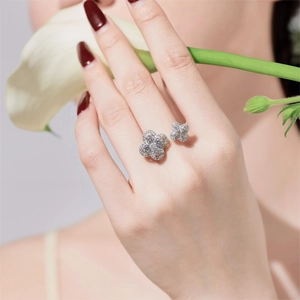 Detail of S925 sterling silver four-leaf clover ring with zircon inlay on model's hand