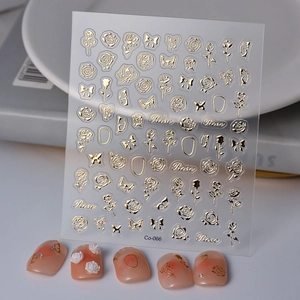 Golden embossed 3D rose and butterfly nail art stickers with elegant floral motifs