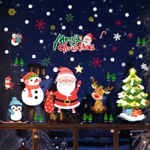 Detail of Christmas window stickers featuring Santa, snowman and elk in a winter scene