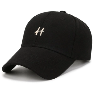 Black canvas baseball cap featuring white 3D letter H embroidery and a curved brim