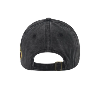 Detail view of washed cotton baseball cap with adjustable metal buckle and embroidery