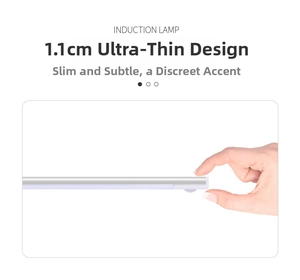 Slim 1.1cm silver motion sensor light bar with aluminum housing held for scale