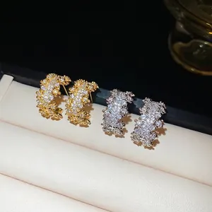 Elegant C-shaped earrings with pavé zircons in gold and silver finish for women