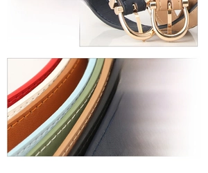 Detail view of colorful PU leather belts with elegant golden horseshoe buckles for women