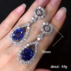 Silver drop earrings with blue cubic zirconia stones, length 35mm and weight 4.9g