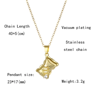 Detail of gold rectangular wrinkled pendant with zircon and stainless steel chain specs