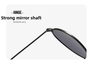 Macro detail of the sturdy metal hinge and mirror axis on classic oval sunglasses