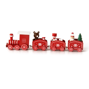 Detail of red wooden Christmas train with miniature snowman, bear, and tree figures