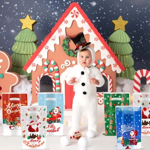 Assorted Christmas gift bags with festive Santa and snowman prints and handles