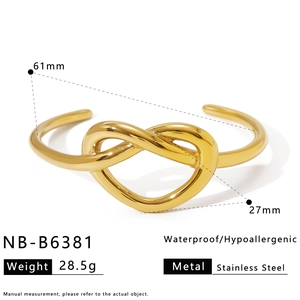 Detail of gold stainless steel knot bangle with 61mm diameter size specifications