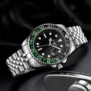 Macro shot of stainless steel luxury watch featuring a two-tone green and black GMT bezel