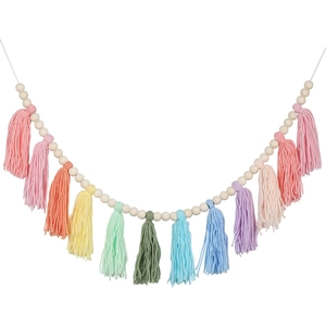 Bohemian garland featuring natural wood beads and colorful cotton tassels for wall decor