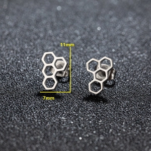 Detailed view of silver honeycomb stud earrings with size measurements 11mm by 7mm