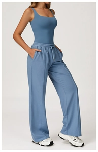Detail of high waist drawstring sweatpants and slim camisole set with vertical seams