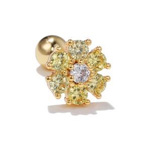 Detail of 18k gold plated flower stud earring with sparkling yellow zircon and screw back
