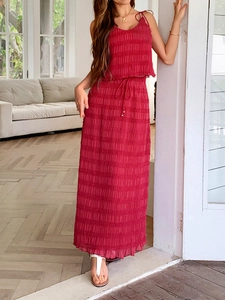 Close-up of red two-piece set featuring pleated texture and drawstring waist detail