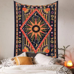 Detailed sun and moon mandala tapestry hanging as a warm bedroom background decor
